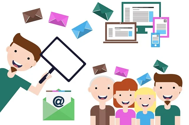 Some people are standing smiling while there are laptop and computer at the background and several icons of email are in bulk position showing email marketing