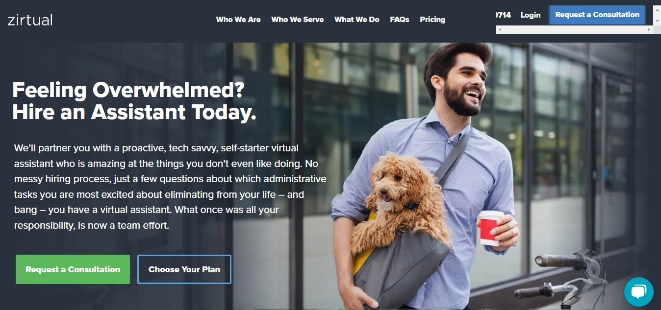 A man is standing, smiling carrying a dog and a bag at the interface of zirtual.com